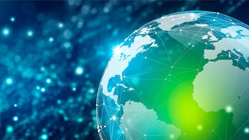 Globe terrestre numérique avec réseaux d'interconnexions mondiales illustrant le débat sur la démondialisation