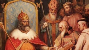 Peinture historique représentant Charlemagne sur son trône entouré de clercs, contexte de la biographie d'Eginhard