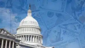 Le Capitole américain superposé à des billets de 100 dollars, illustration du lobbying aux États-Unis